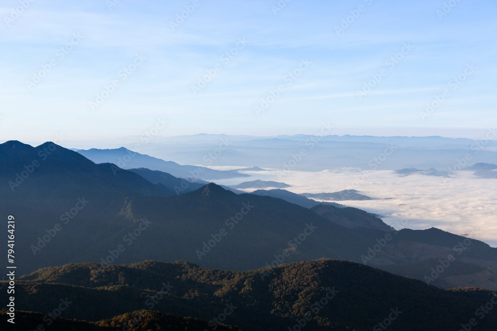 Sea of mist and clouds view from the highest mountain in Thailand. Doi Inthanon National Park. Amazing Nothern Thailand Landscape.