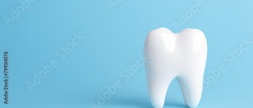 Tooth model on a blue background. 3d illustration. Dental Concept with Copy Space.