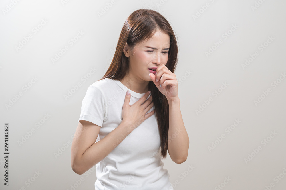 Female unhealthy Sickness, asian young woman, girl unwell and coughing, have cold, sore throat isolated white background suffering with symptom cough feeling bad. Healthcare of Coronavirus, covid-19. Female unhealthy Sickness, asian young woman, girl unwell and coughing, have cold, sore throat isolated white background suffering with symptom cough feeling bad. Healthcare of Coronavirus, covid-19.