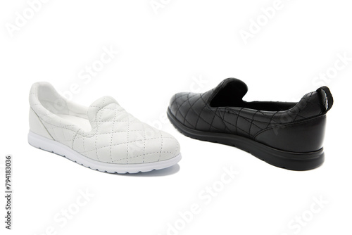 Sneakers. Pair of fashionable leather shoes isolated on white background. Black and white shoes.	