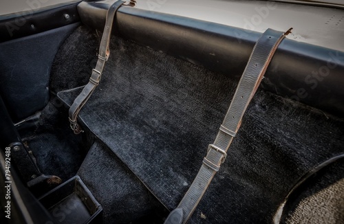 Leather luggage straps in a car