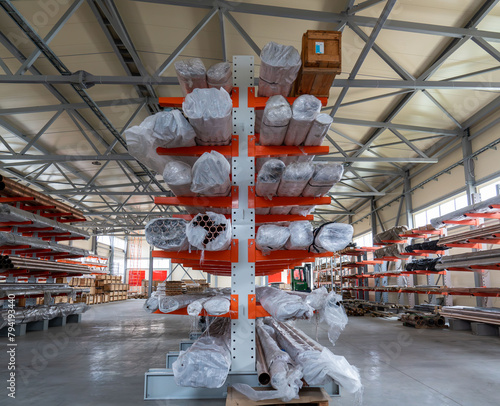 фотографія Warehouse cantilever racks for storing copper pipes or profiles