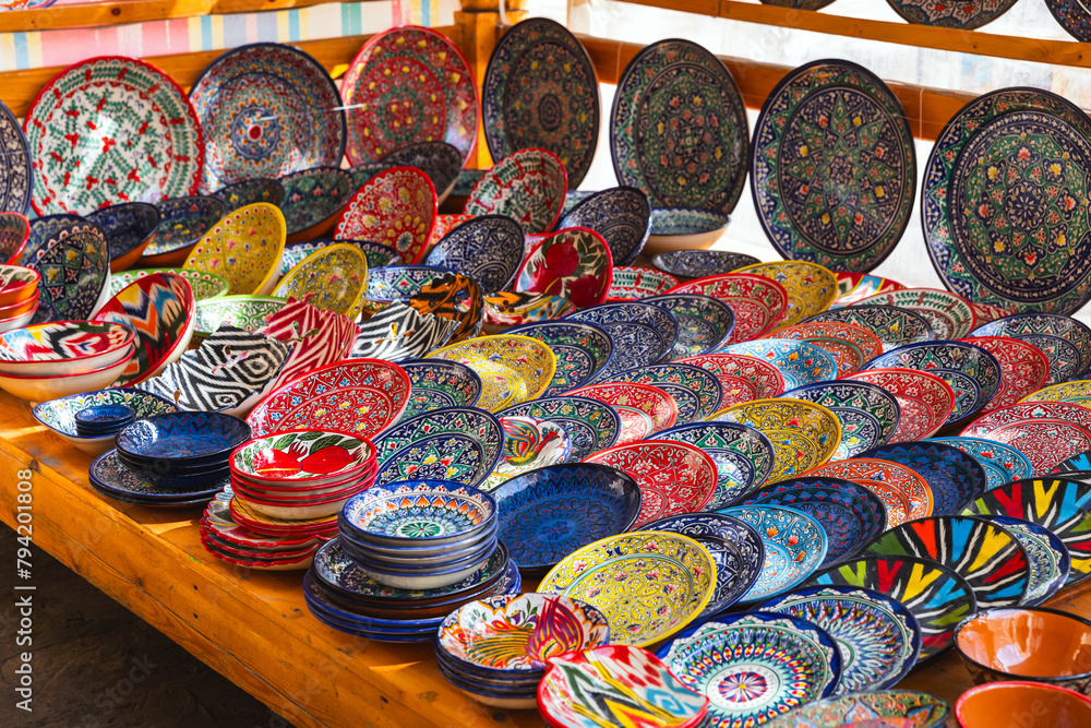 Fototapeta premium Handmade Uzbek plates and bowls with colorful traditional patterns