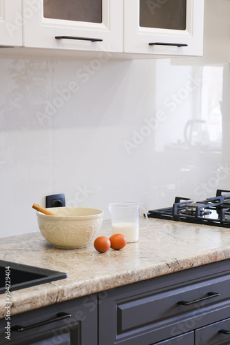 Wallpaper Mural Home kitchen interiorBowl with dough, eggs and bowl of sugar on kitchen table in modern kitchen. Torontodigital.ca