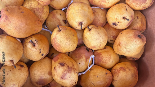 Sweet, organic pears on the market shelf.