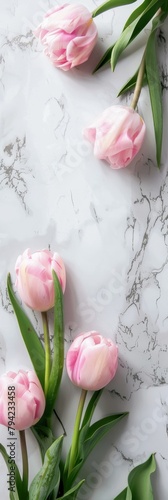 Marble Table Adorned With Pink Flowers and Green Leaves