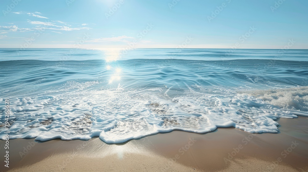   The sun shining brightly, water reflecting, waves crashing on sand Blue sky dotted with white clouds