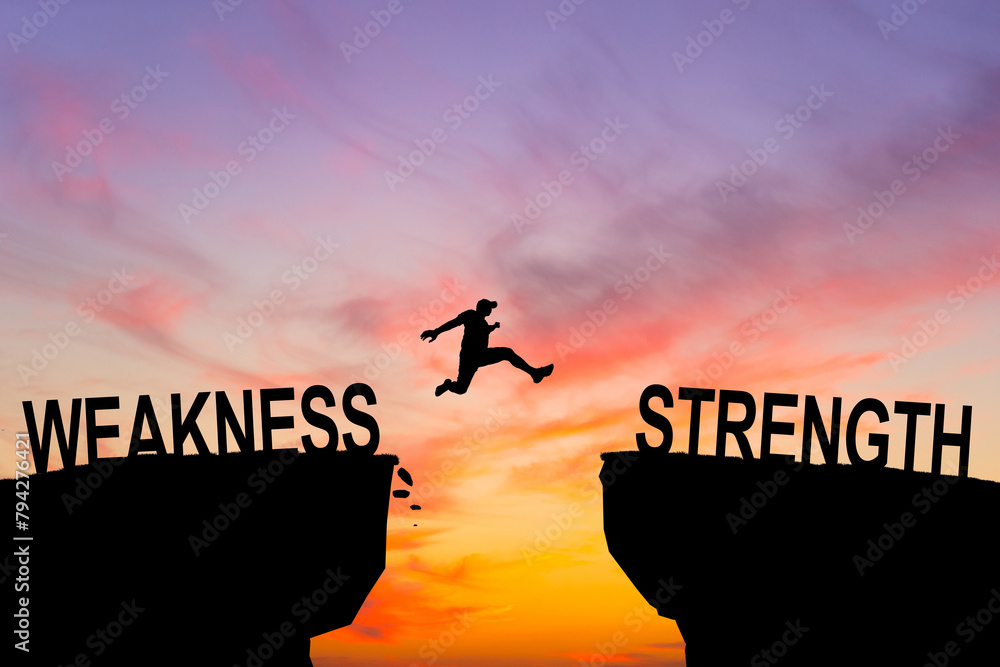 Man jump through the gap between hill. Weakness and Strength. Stock