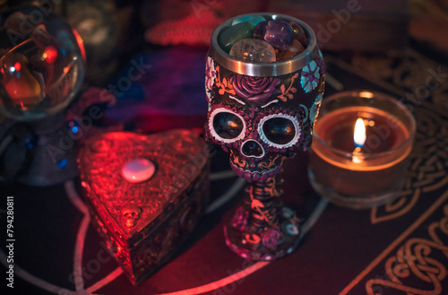 Altar cups with a skull with flowers. Santa Muertos or Saint death concept

