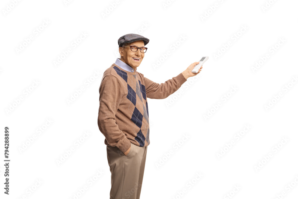 Happy elderly man holding a remote controller for AC unit Happy elderly man holding a remote controller for AC unit