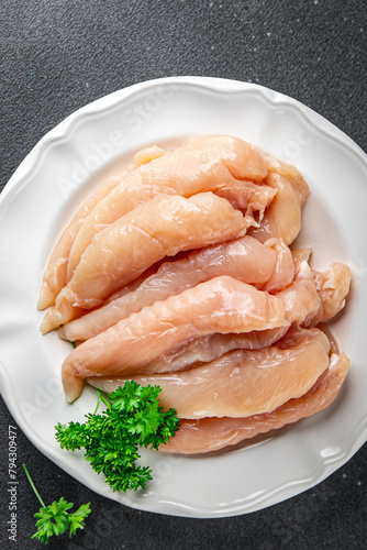 raw chicken meat aiguillettes fresh cooking appetizer meal food snack on the table copy space food background rustic top view keto or paleo diet