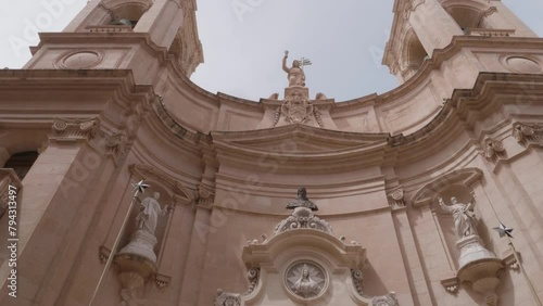 A pan up of the exterior of St Johns Cathedral, Valletta, Malta photo