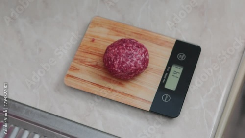 weighing hamburger meat on the scale