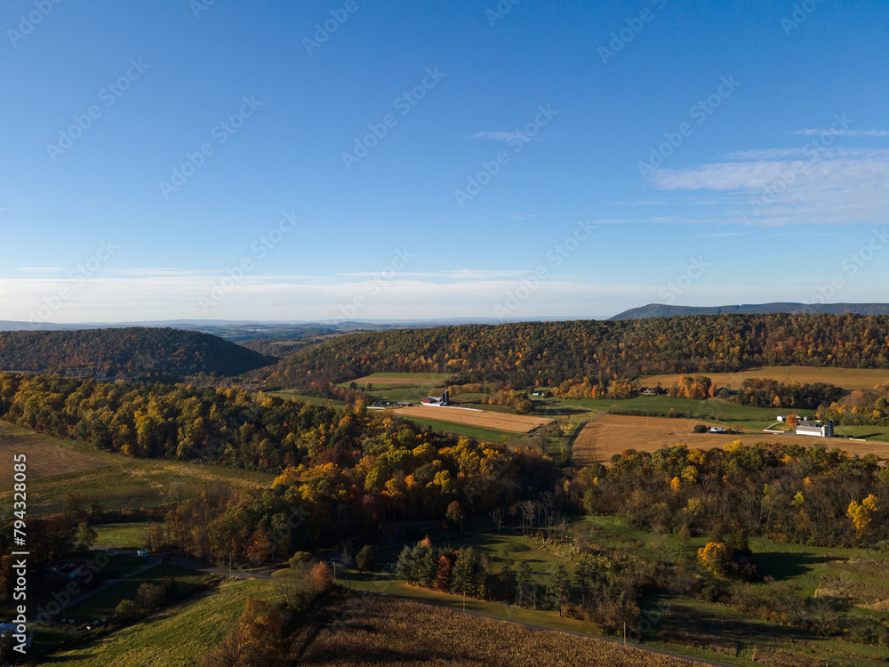 Naklejka premium Aerial landscape of corn field farmland in the Appalachian mountains in rural Central Pennsylvania