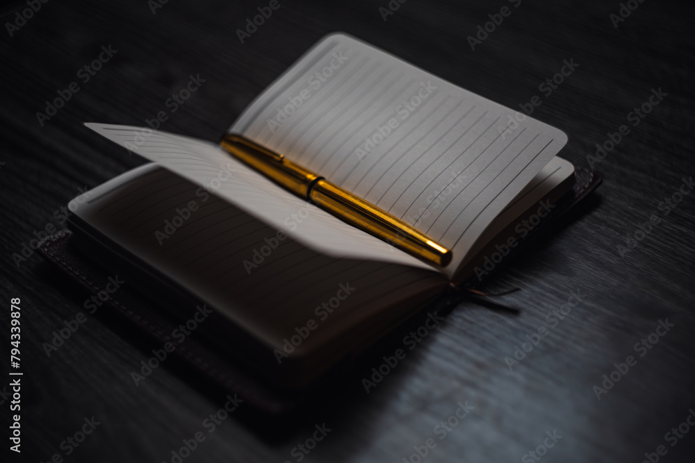 Subject shooting - Notepad and gold pen Subject shooting - Notepad and gold pen
