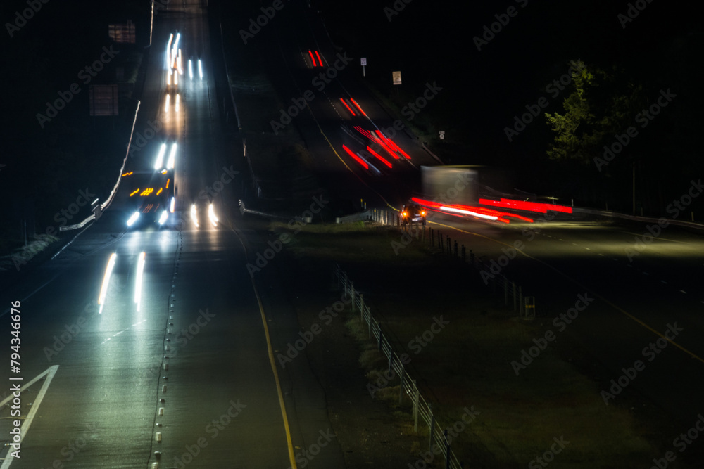 Traffic close up on dark rural highway at night Traffic close up on dark rural highway at night