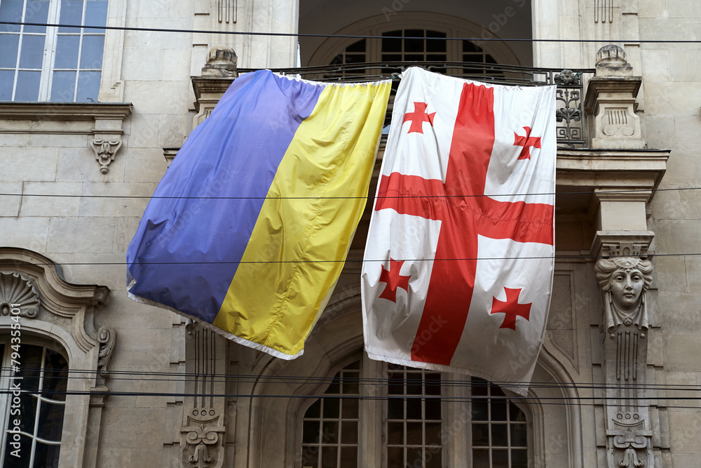 Flags of Ukraine and Georgia waving on the balcony of an old building in Tbilisi, Georgia