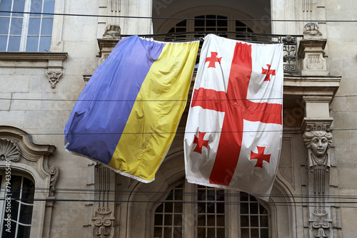 Flags of Ukraine and Georgia waving on the balcony of an old building in Tbilisi, Georgia