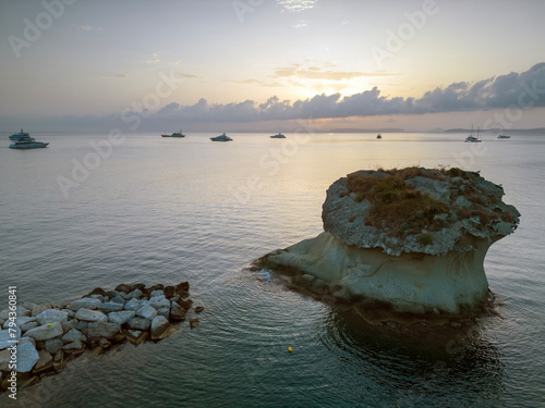 Aerial sunrise view of the port of Lacco Ameno in Ischia. Rock, sea, sun and a thousand colors photo