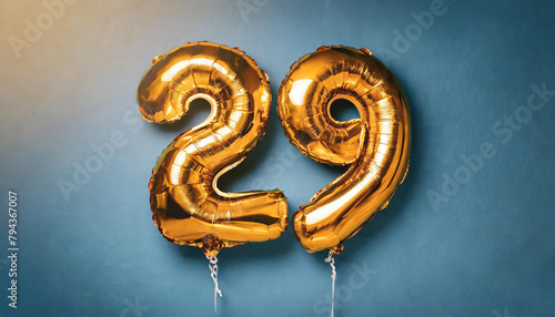 Banner with number 29 golden balloon. 29 years anniversary celebration. Bright blue background.