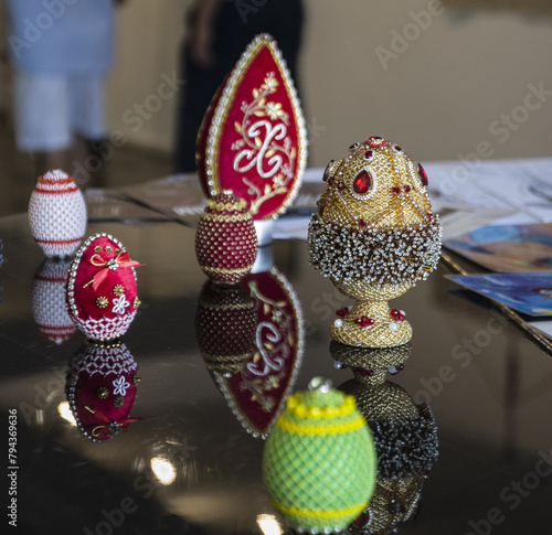 Decorative eggs made from gold beads and glass stones