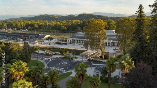 Traffic Timelapse of road at train station of Pau City during golden hour