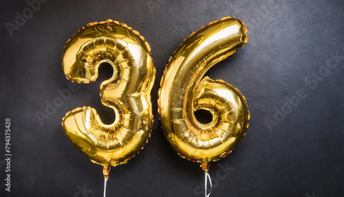 Banner with number 36 golden balloon. Thirty six years anniversary celebration. Black background.