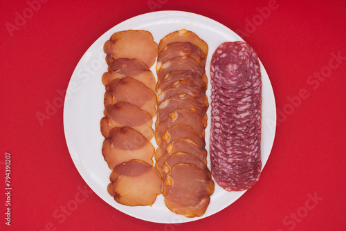 Artisanal Charcuterie Selection on Vibrant Red