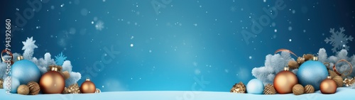 Christmas banner in blue color with snowflakes and Christmas decorations on top.