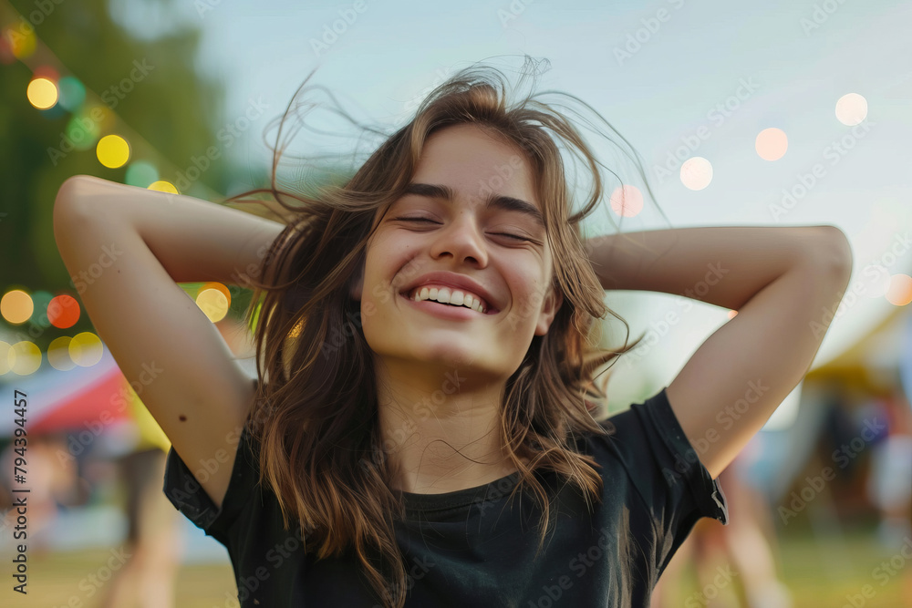 Portrait of a beautiful young woman smiling with her eyes closed and her hands behind her head. Portrait of a beautiful young woman smiling with her eyes closed and her hands behind her head.