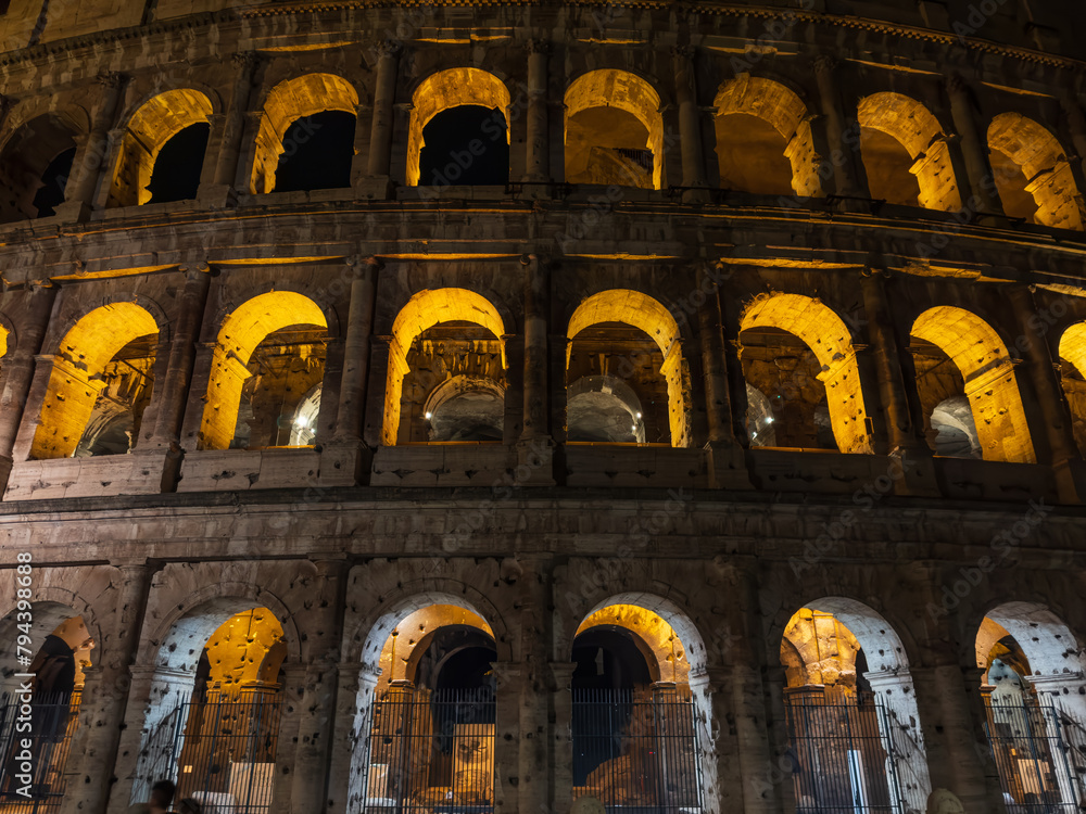 View of the Roman Colosseum illuminated at night