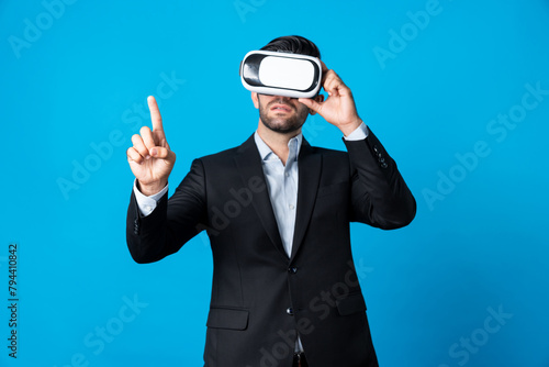 Project manager with virtual reality glasses looking at data analysis while analyzing and pointing data. Skilled business man using VR goggle and digital innovation while enter metaverse. Deviation.