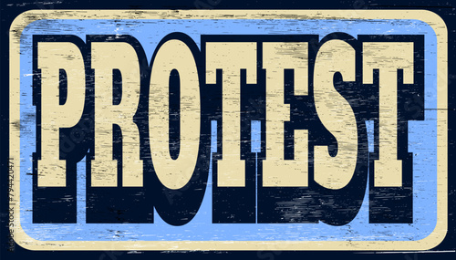 Aged and worn protest sign on wood