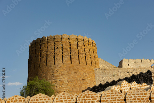 Ancient fortified tower against blue sky, Ranikot, Sindh, Pakistan photo