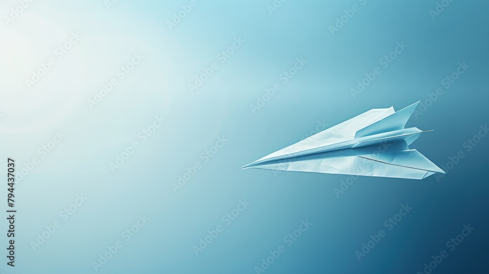 Paper airplane against blue background with light gradient Paper airplane against blue background with light gradient