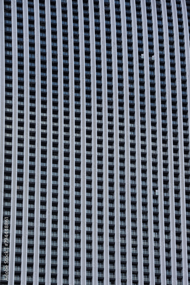 background of new high rise apartment building wall with many balcony and a lot windows. facade, exterior backdrop. facade of a multi-storey residential building background of new high rise apartment building wall with many balcony and a lot windows. facade, exterior backdrop. facade of a multi-storey residential building