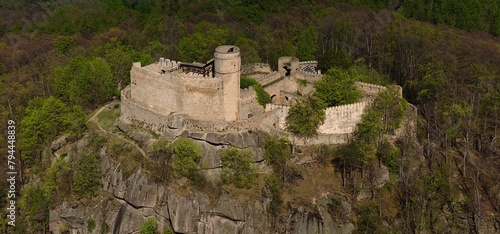 Medieval Chojnik Castle atop Karkonosze mountain in aerial shot. © Grzegorz