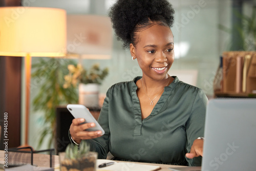 Laptop, phone and smile with business black woman at desk in office for administration or research. Computer, communication and notebook with happy employee in professional workplace for networking