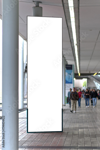 Tall vertical billboard at the trade fair in Milan.