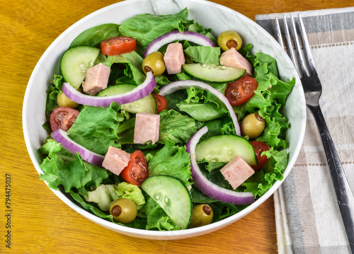 salad top with tomatoes cucumbers and spam