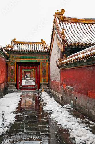 A path through several buildings with open doorways and tile roofs overhead, Forbidden City, Beijing, China