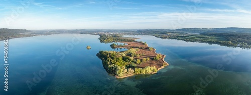 Aerial view, panorama of the Mettnau peninsula with spring-like vegetation, on the horizon the town of Radolfzell on Lake Constance, behind it the Hegau mountains, district of Constance photo