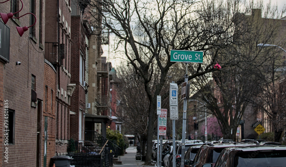 grove street sign on a side street in jersey city new jersey (cars parked on side of road, residential apartment building)