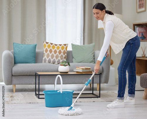 Woman, mop and smile on cleaning floor with home for hygiene, housekeeping and routine. Female person, household and happy with water bucket on day off for chores, fresh in living room or lounge