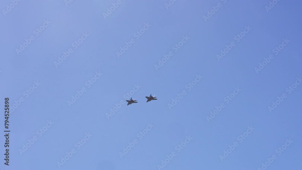 Close up of two F-35 Fighter Jets flying above San Francisco bay in California. The F-35 Lightning II was developed by Lockheed Martin. Close up of two F-35 Fighter Jets flying above San Francisco bay in California. The F-35 Lightning II was developed by Lockheed Martin.
