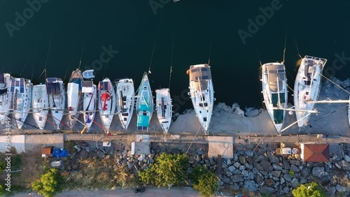 Top down view of Marina with moorings and supplies for yachts and sailboats used exclusively by pleasure crafts such as sloops and cabin cruisers. Aerial. Küçükyalı Shore, Istanbul, Turkey
 photo
