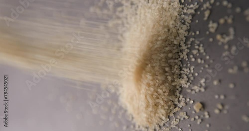 Brown sugar pouring slow motion in studio 4K pro res vertical photo