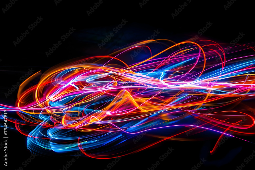 Energetic neon light painting with swirling colors. Abstract forms on black background.