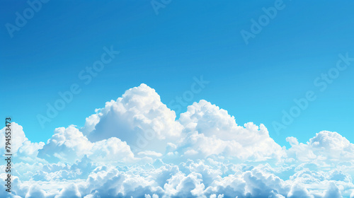 White clouds at the bottom of the picture on pure bluesky with empty copy space for text. The sky is blue and filled with clouds. The clouds are white and fluffy, and they cover the entire sky.  photo