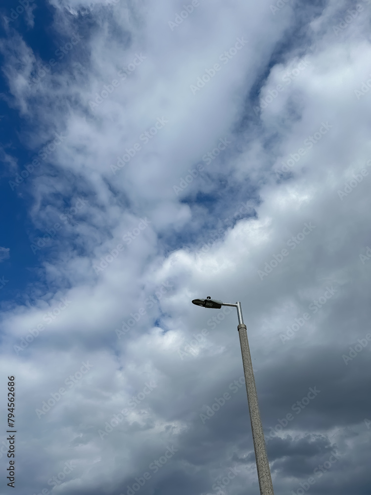 Lamppost with clouds and blue sky